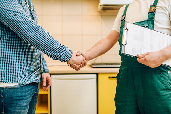 Home seller shaking hands with home inspector from Hazelbaker Inspections